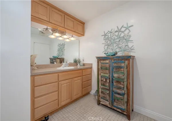 a bathroom with a sink and vanity