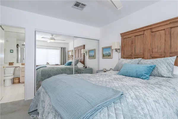 a bathroom with a tub a sink and mirror
