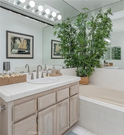 a bathroom with a bathtub and a sink