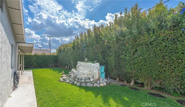 a front view of house with yard and outdoor seating