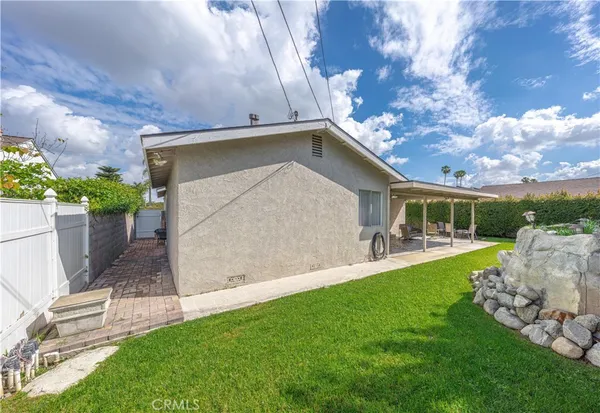 a view of a house with a yard porch and sitting area