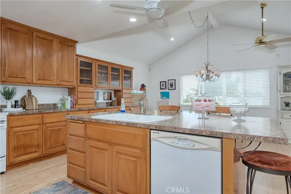 a kitchen with cabinets a sink and appliances