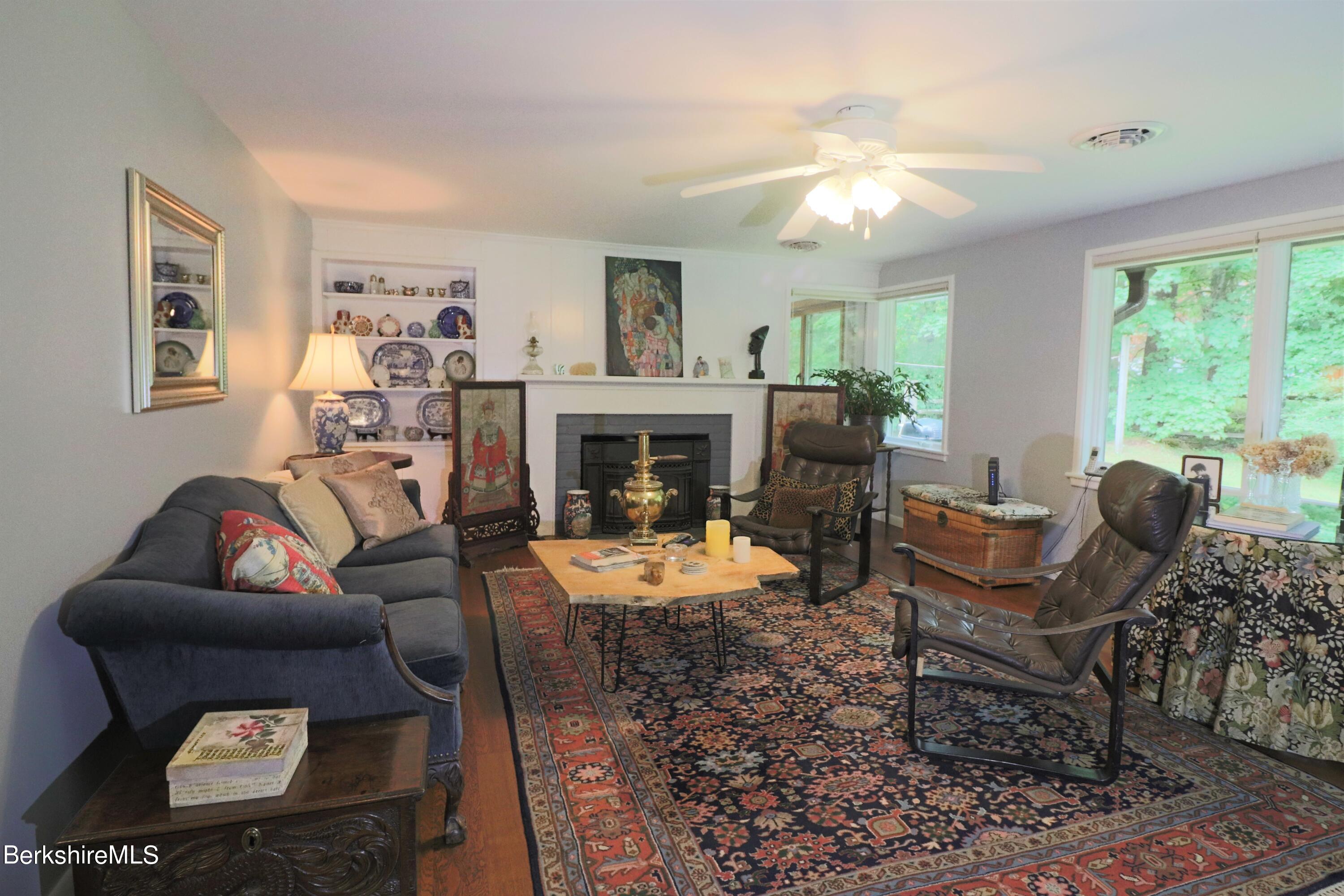 13 Cherry Hill Road Stockbridge, MA 01262 - Photo 11 of 41 a living room with furniture and a fireplace