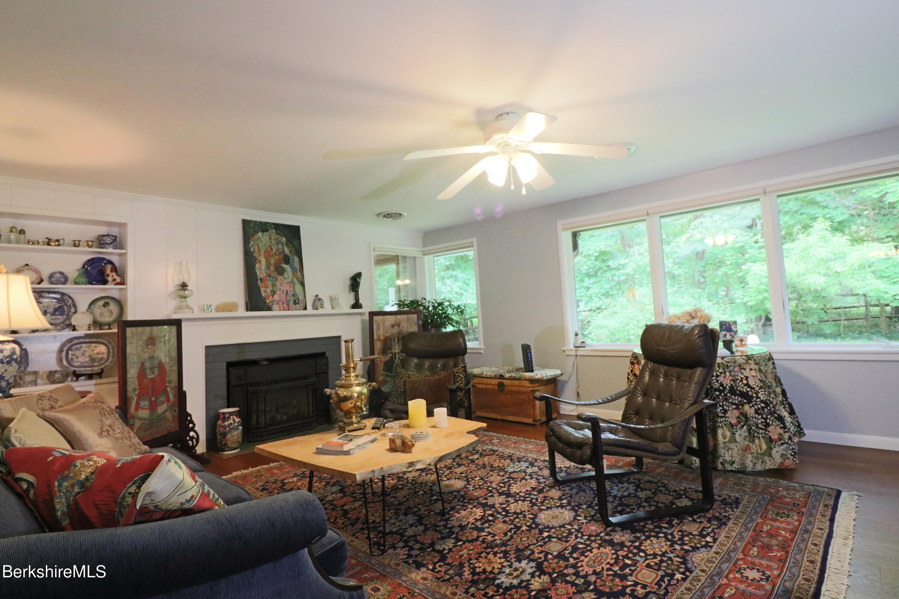 13 Cherry Hill Road Stockbridge, MA 01262 - Photo 12 of 41 a living room with furniture a fireplace and a large window