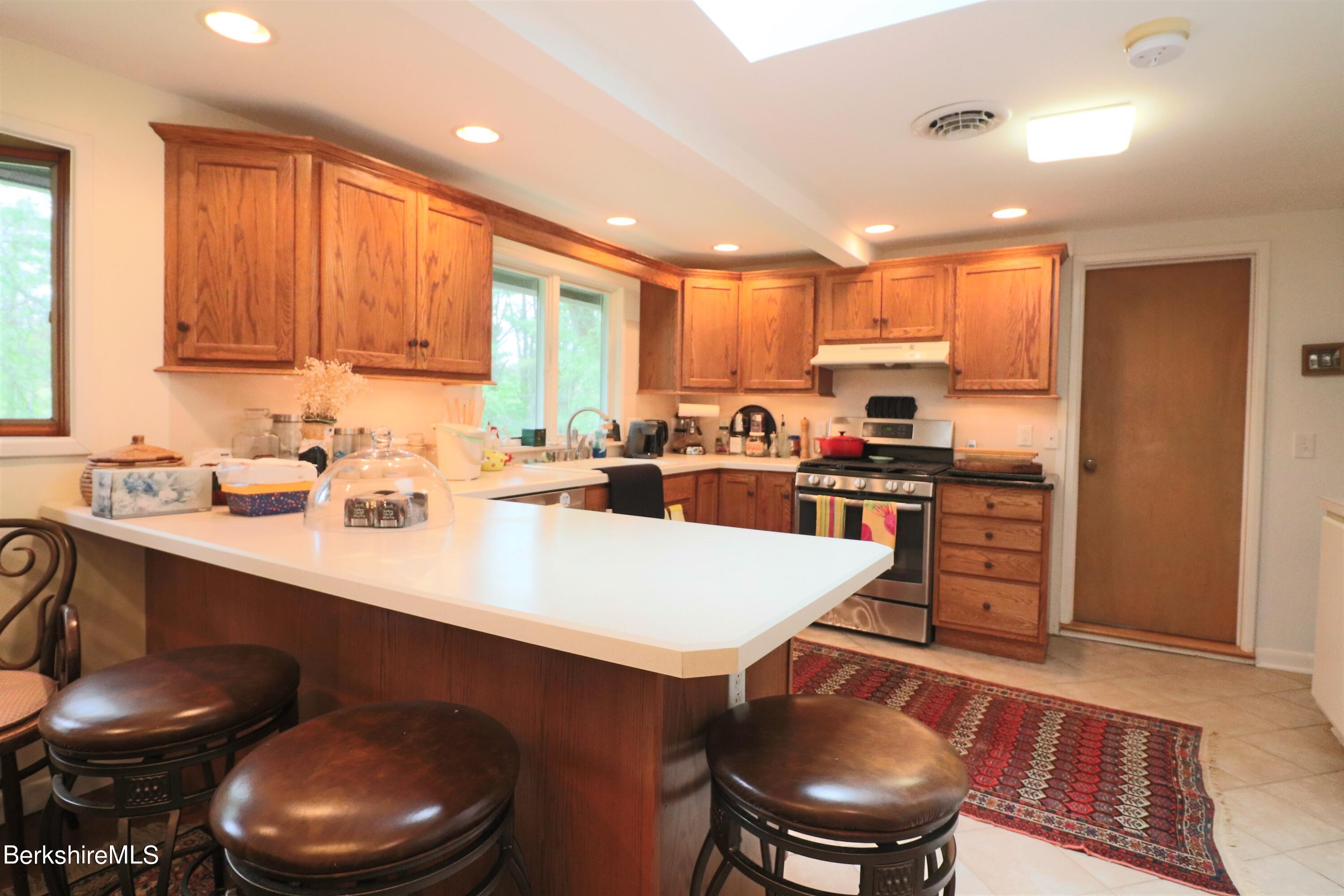 13 Cherry Hill Road Stockbridge, MA 01262 - Photo 19 of 41 a kitchen with a sink appliances and cabinets