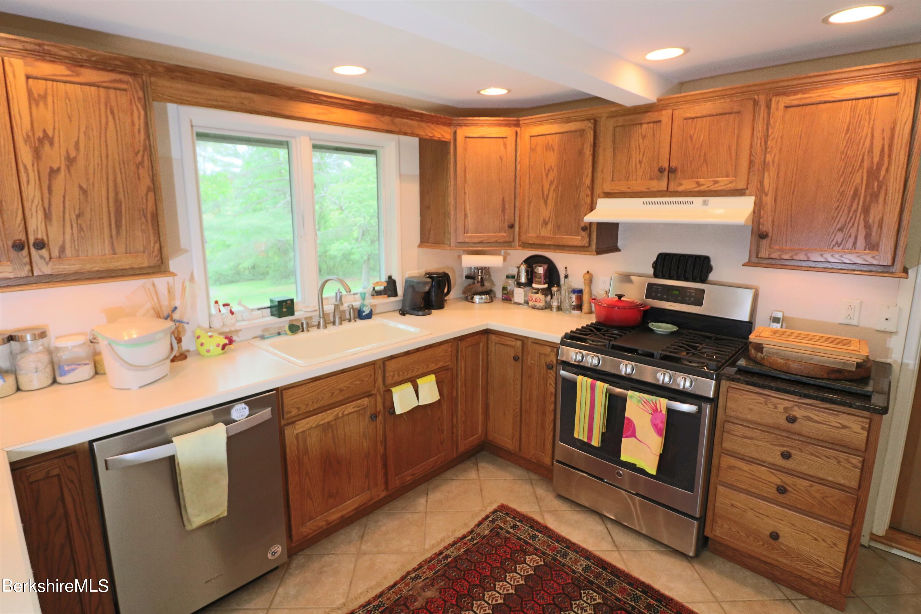 13 Cherry Hill Road Stockbridge, MA 01262 - Photo 20 of 41 a kitchen with stainless steel appliances granite countertop a stove a sink and a microwave