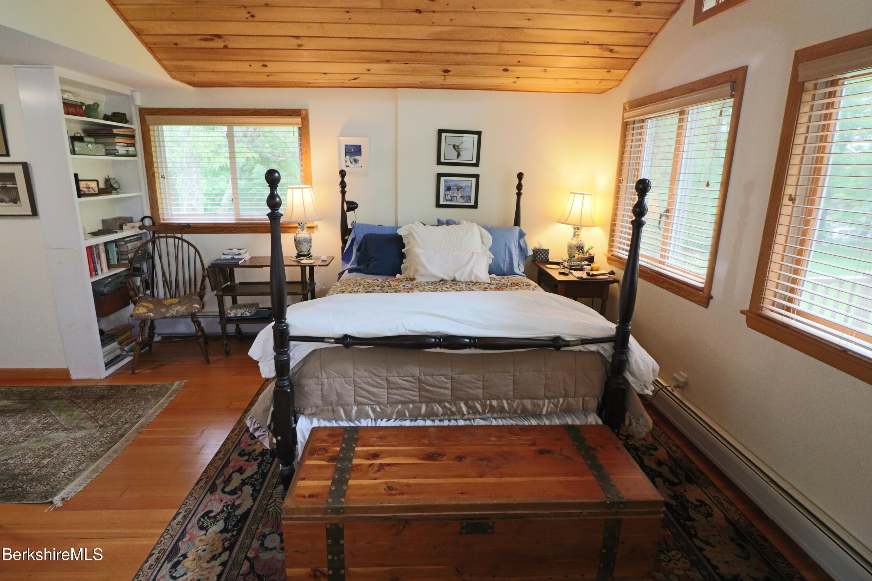 13 Cherry Hill Road Stockbridge, MA 01262 - Photo 25 of 41 a bed sitting in a bedroom next to a window