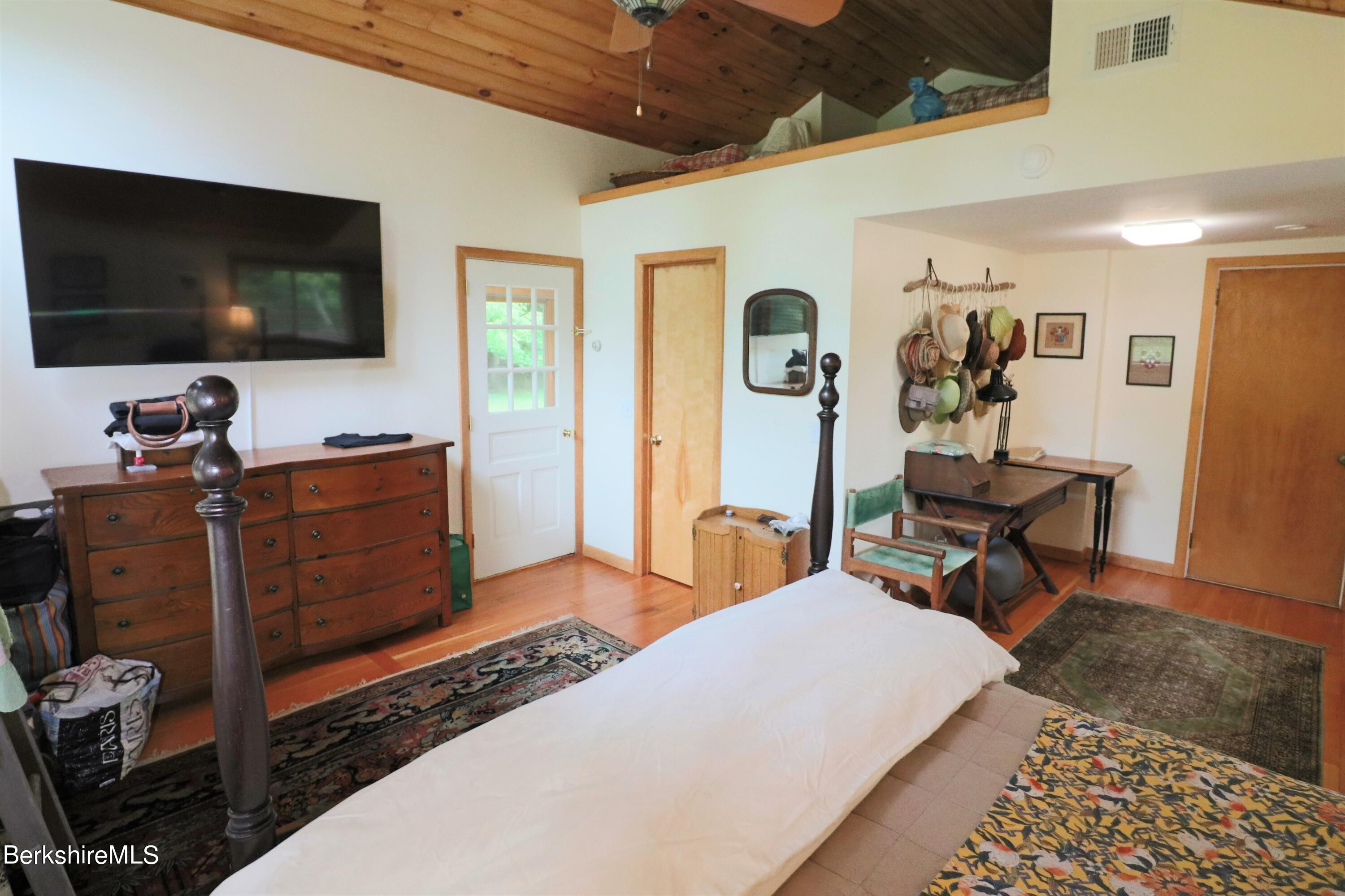 13 Cherry Hill Road Stockbridge, MA 01262 - Photo 27 of 41 a living room with furniture and a flat screen tv