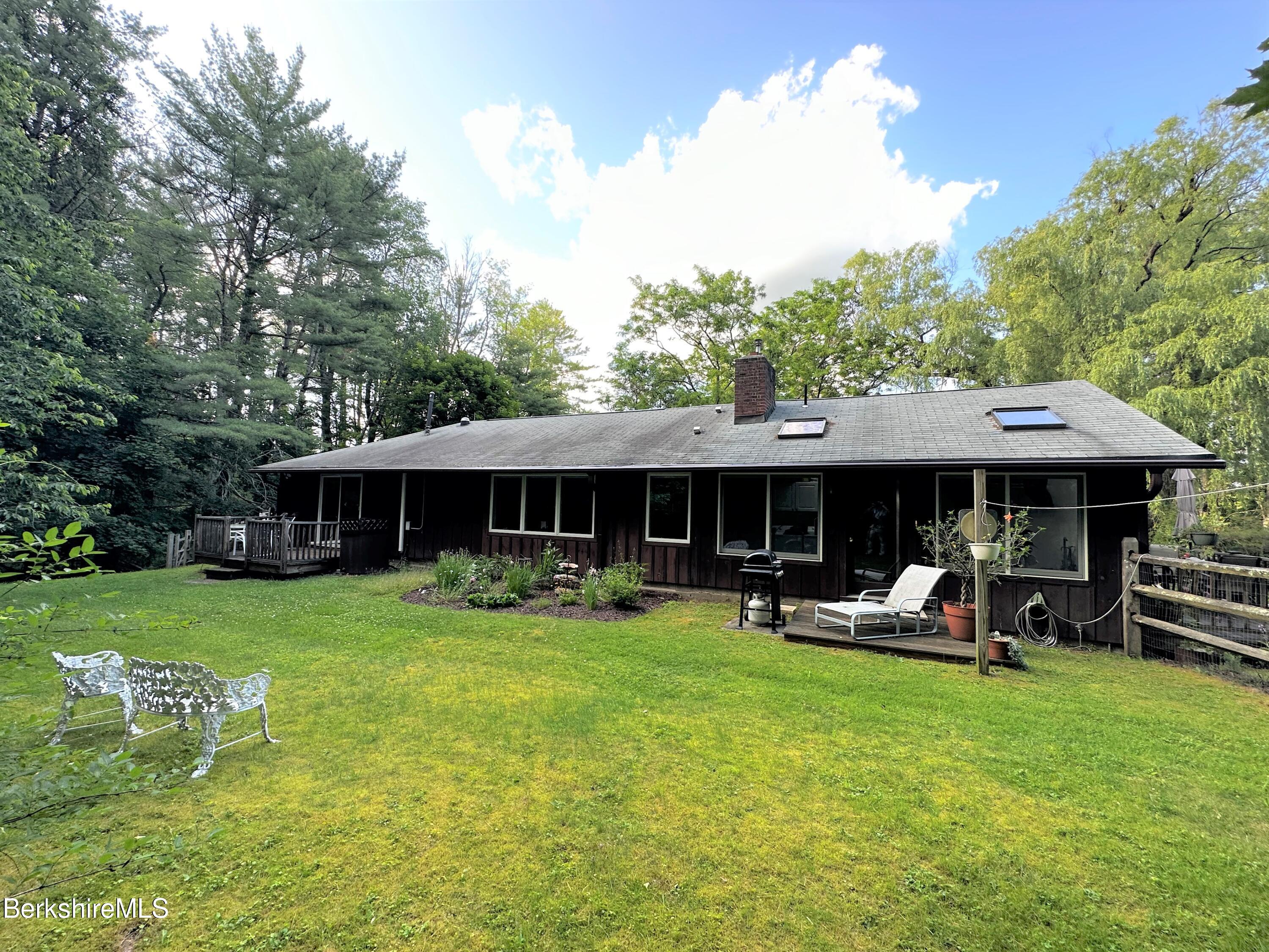 13 Cherry Hill Road Stockbridge, MA 01262 - Photo 3 of 41 a view of a house with a yard porch and sitting area
