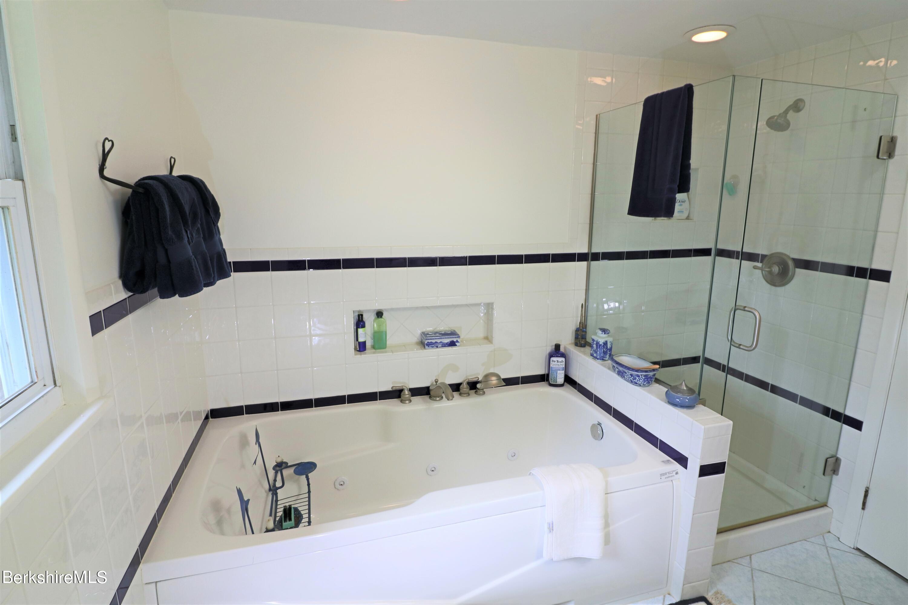 13 Cherry Hill Road Stockbridge, MA 01262 - Photo 33 of 41 a bathroom with a bathtub and a shower