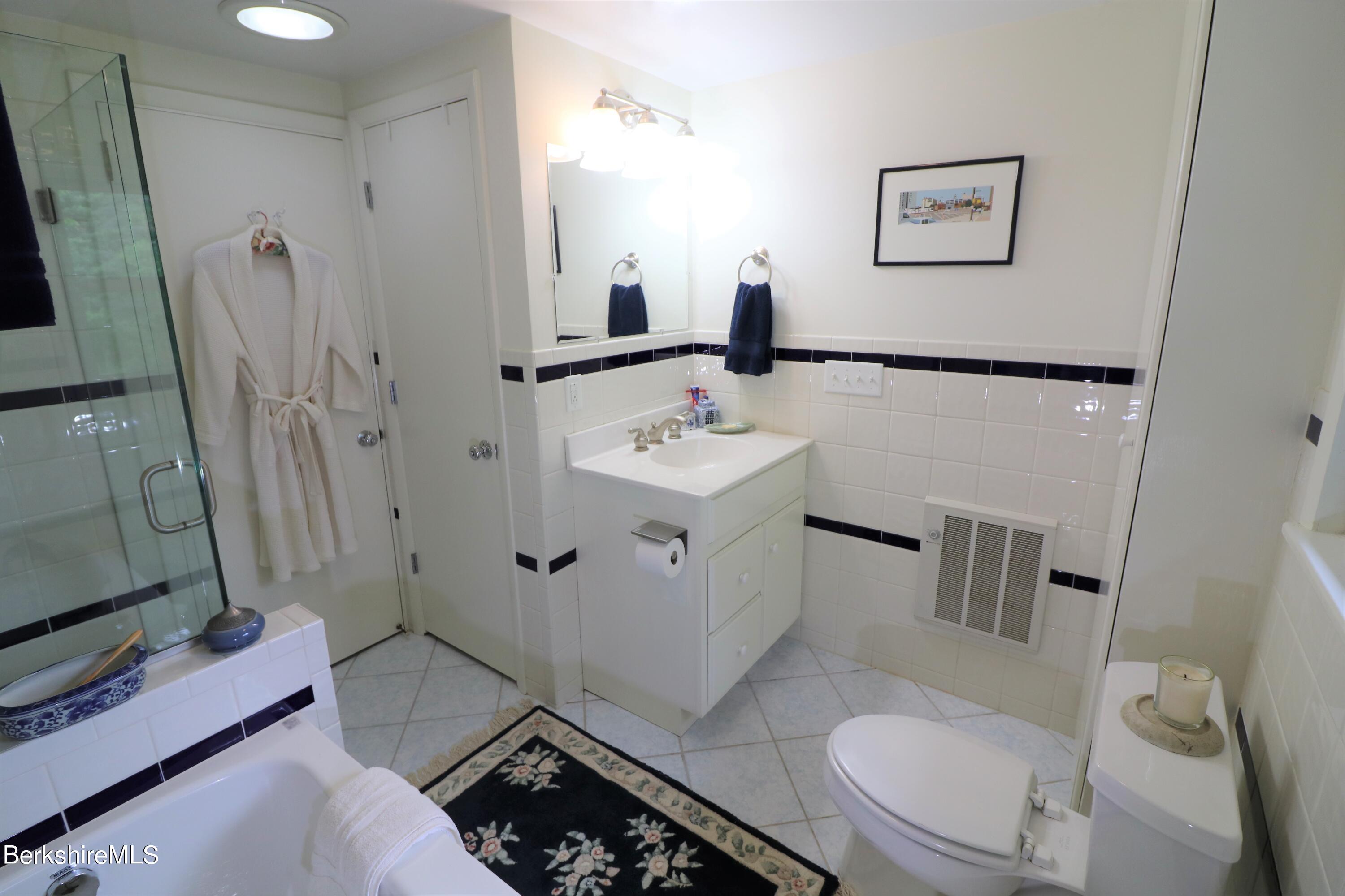 13 Cherry Hill Road Stockbridge, MA 01262 - Photo 34 of 41 a bathroom with a sink toilet and shower