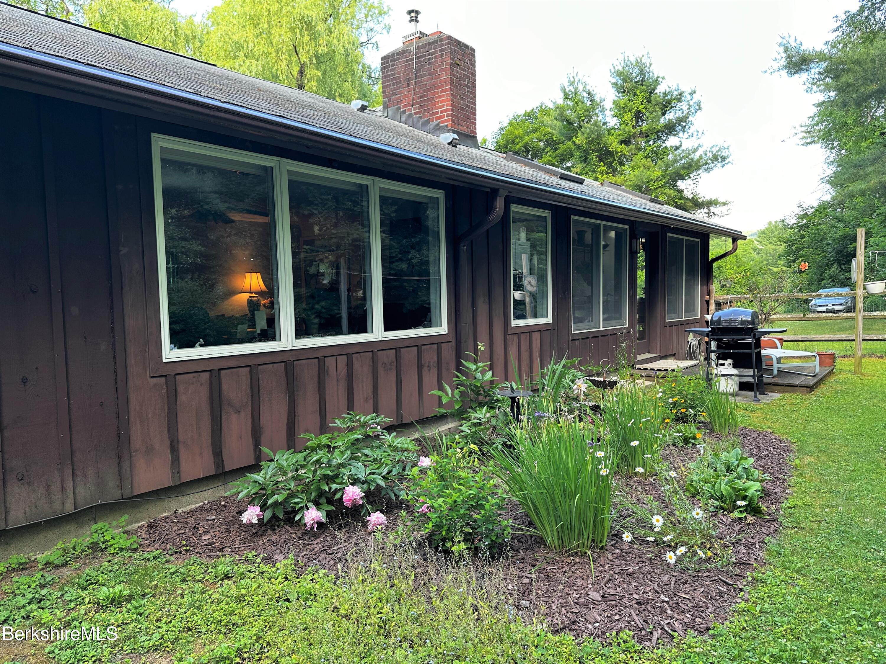 13 Cherry Hill Road Stockbridge, MA 01262 - Photo 4 of 41 a view of a house with sitting area and garden