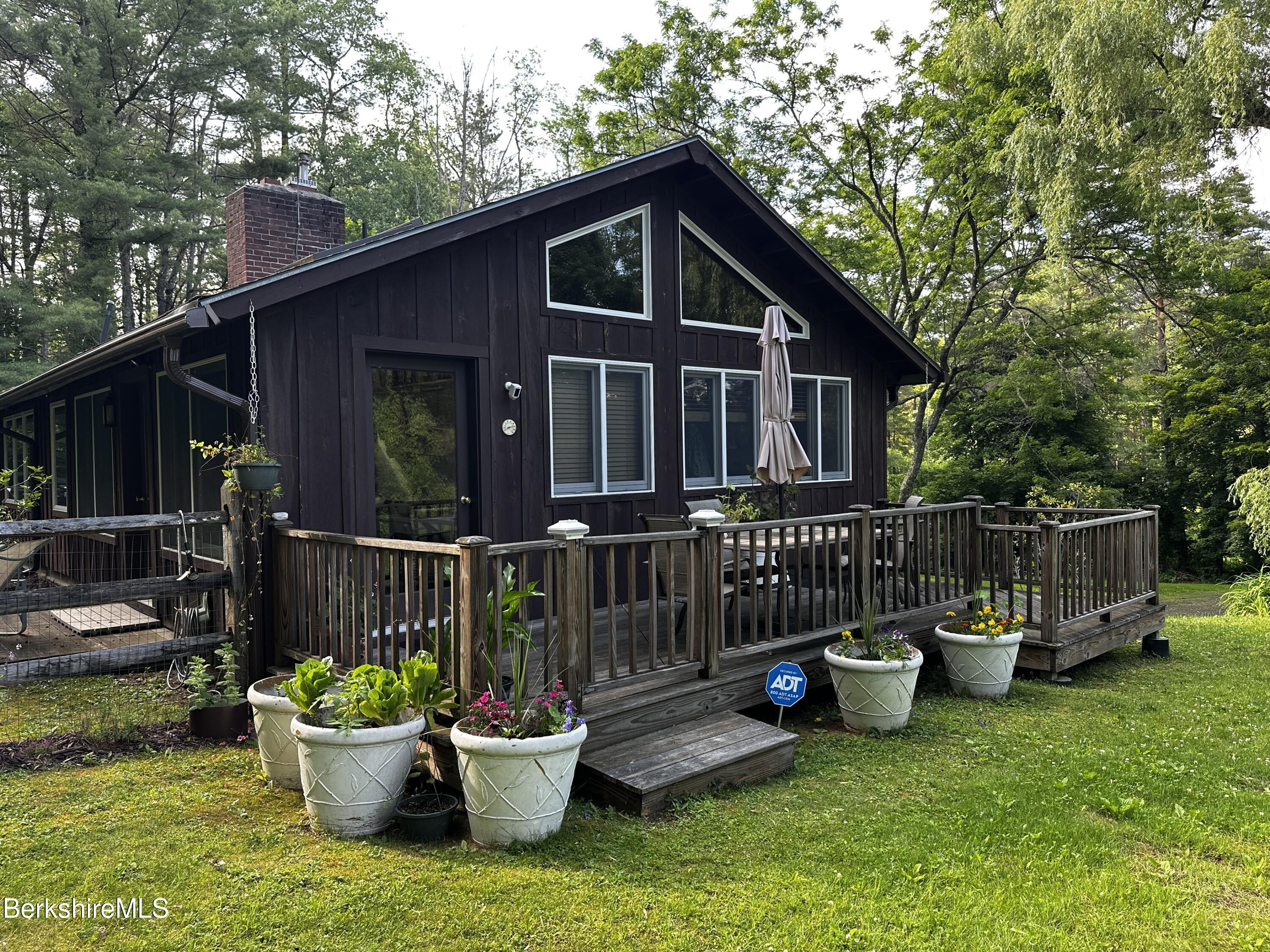 13 Cherry Hill Road Stockbridge, MA 01262 - Photo 7 of 41 a view of a deck with furniture and garden