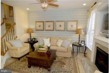 7683 Elmcrest Road Hanover, MD 21076 - Photo 4 of 13 a living room with furniture and a fireplace