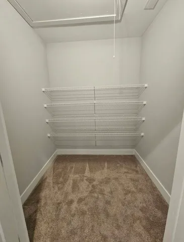 a view of a room with racks on the wall