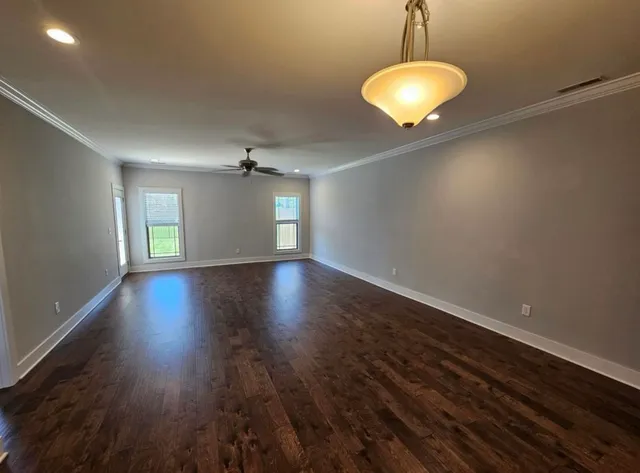 a large kitchen with kitchen island a sink stove and refrigerator
