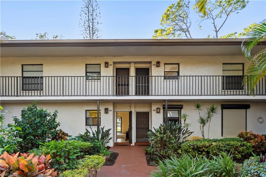 1733 Courtyard Way, Unit 204 Naples, FL 34112 - Photo 2 of 15 View of apartment building / complex