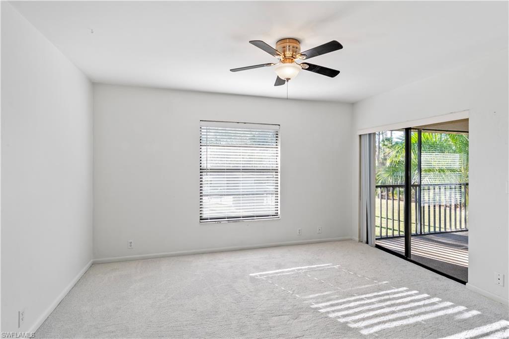 1733 Courtyard Way, Unit 204 Naples, FL 34112 - Photo 8 of 15 Carpeted spare room with ceiling fan and baseboards