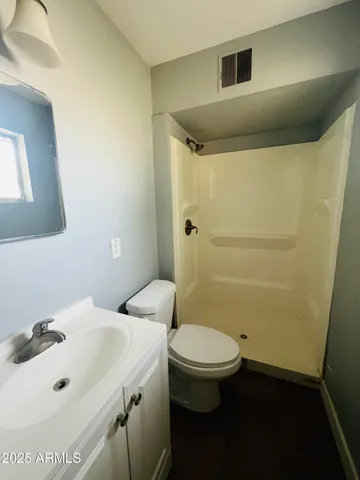 a bathroom with a sink and toilet