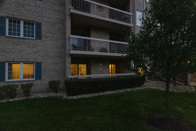 a view of house and yard with green space