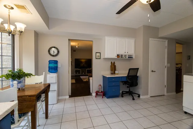 a view of a workspace with furniture