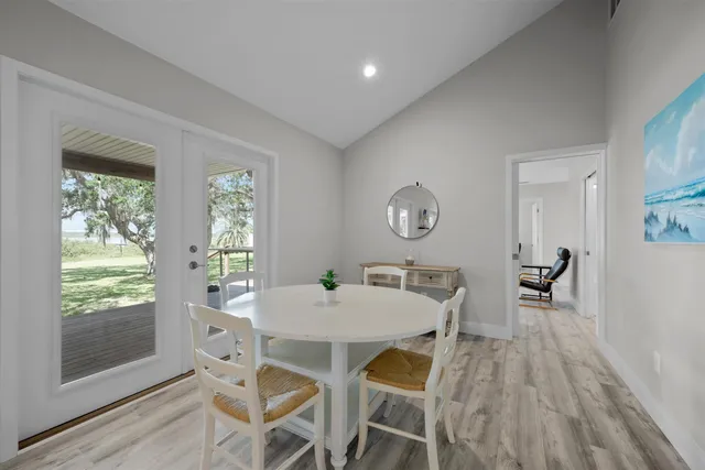 a view of a dining room with furniture and window
