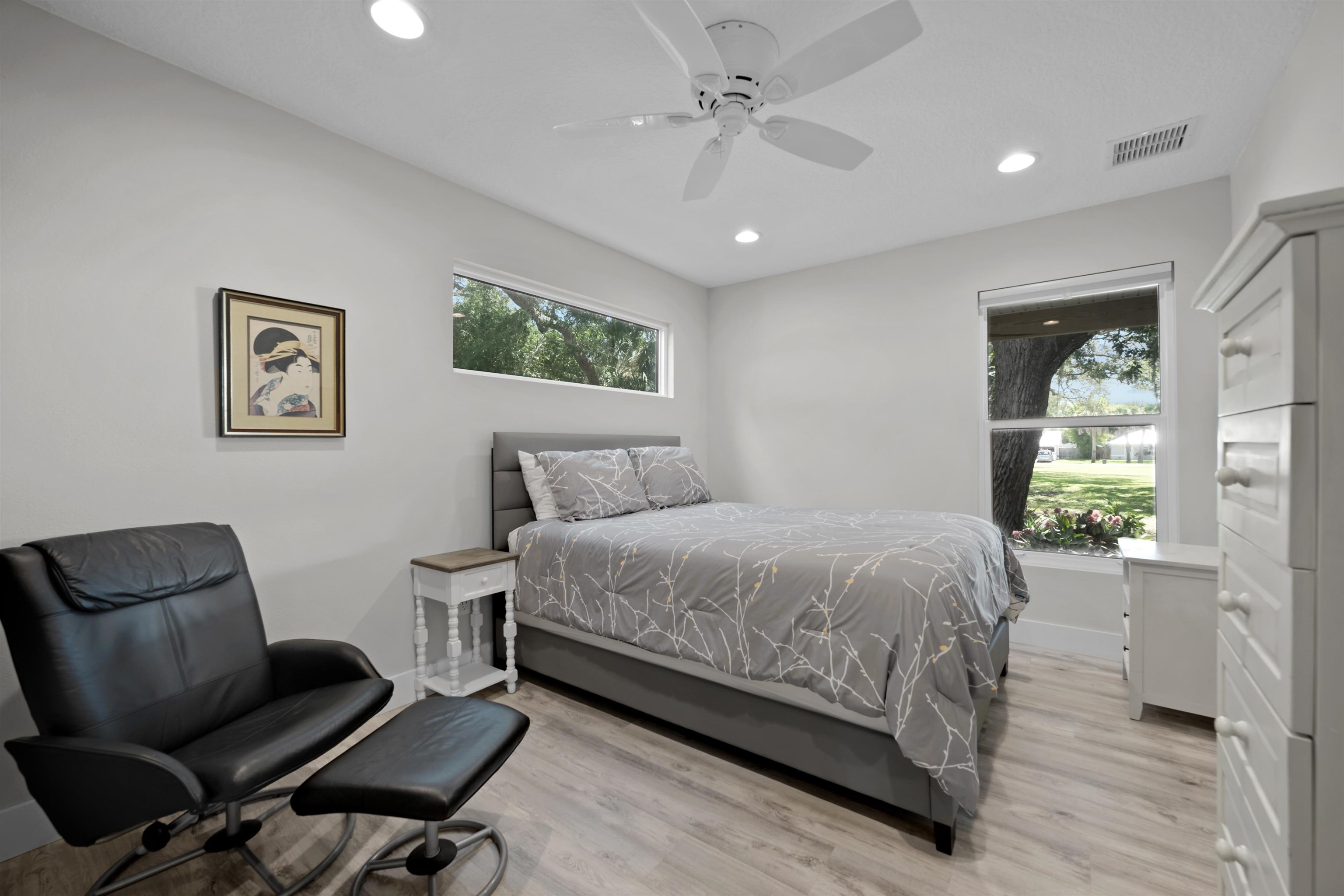 5425 Windantide Road St. Augustine, FL 32080 - Photo 20 of 33 a bedroom with a bed and a chair