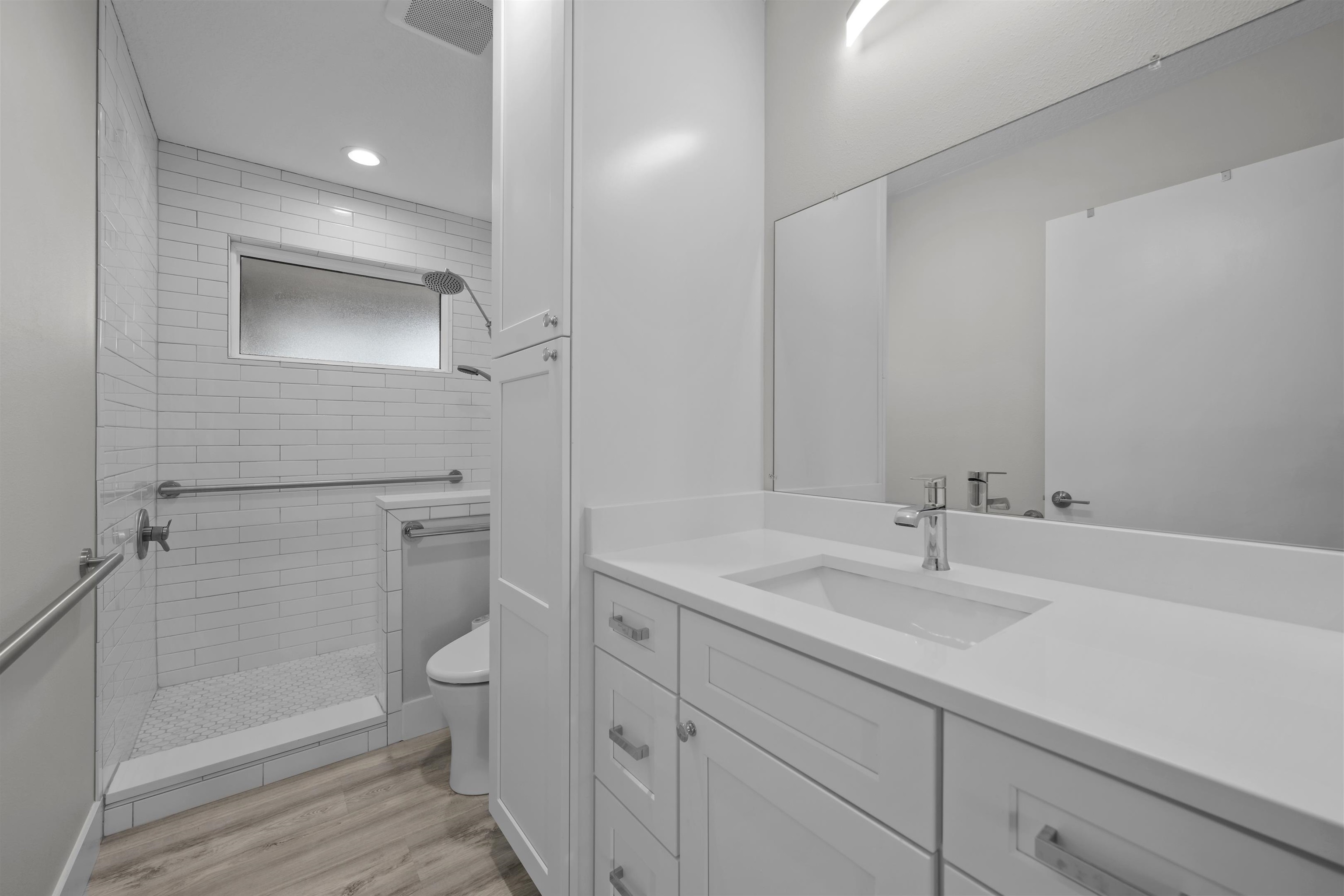 5425 Windantide Road St. Augustine, FL 32080 - Photo 21 of 33 a bathroom with a sink a toilet and shower