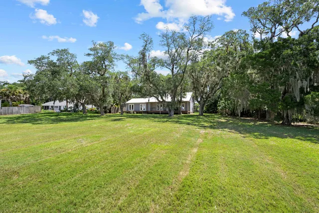 a view of a swimming pool with a yard