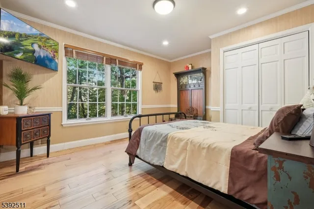 a bedroom with a large bed and a window