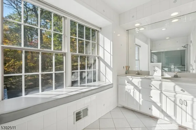 a view of large kitchen with granite countertop a large window