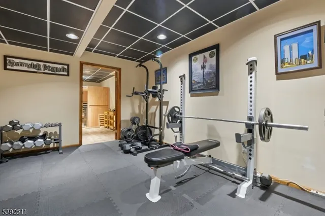 a view of a house with a yard covered in snow