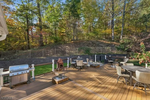 a view of backyard with swimming pool and seating space
