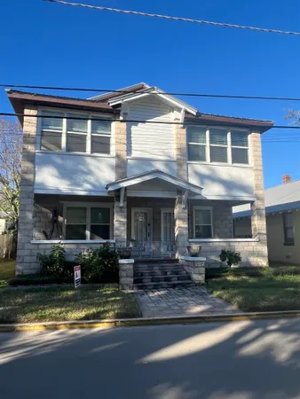a front view of a house with swimming pool