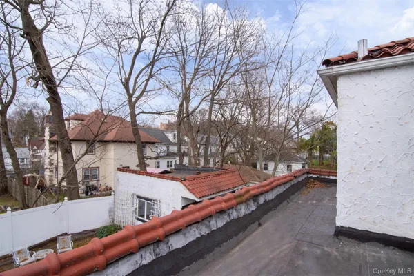 a backyard of a house with barbeque oven
