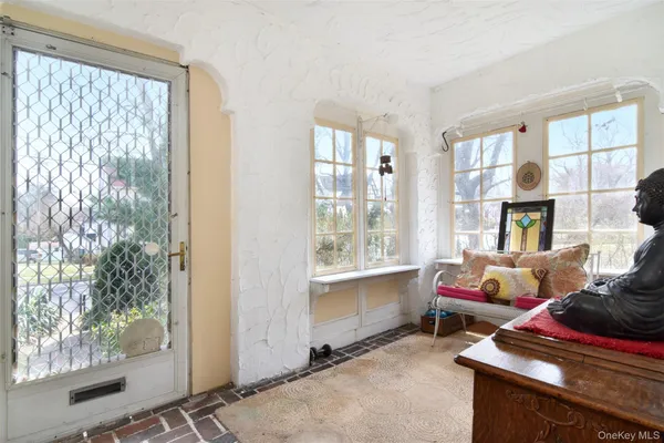 a bedroom with furniture and a window