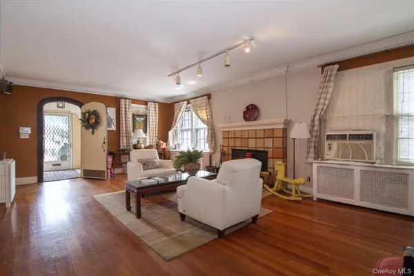 a living room with furniture fireplace and flat screen tv