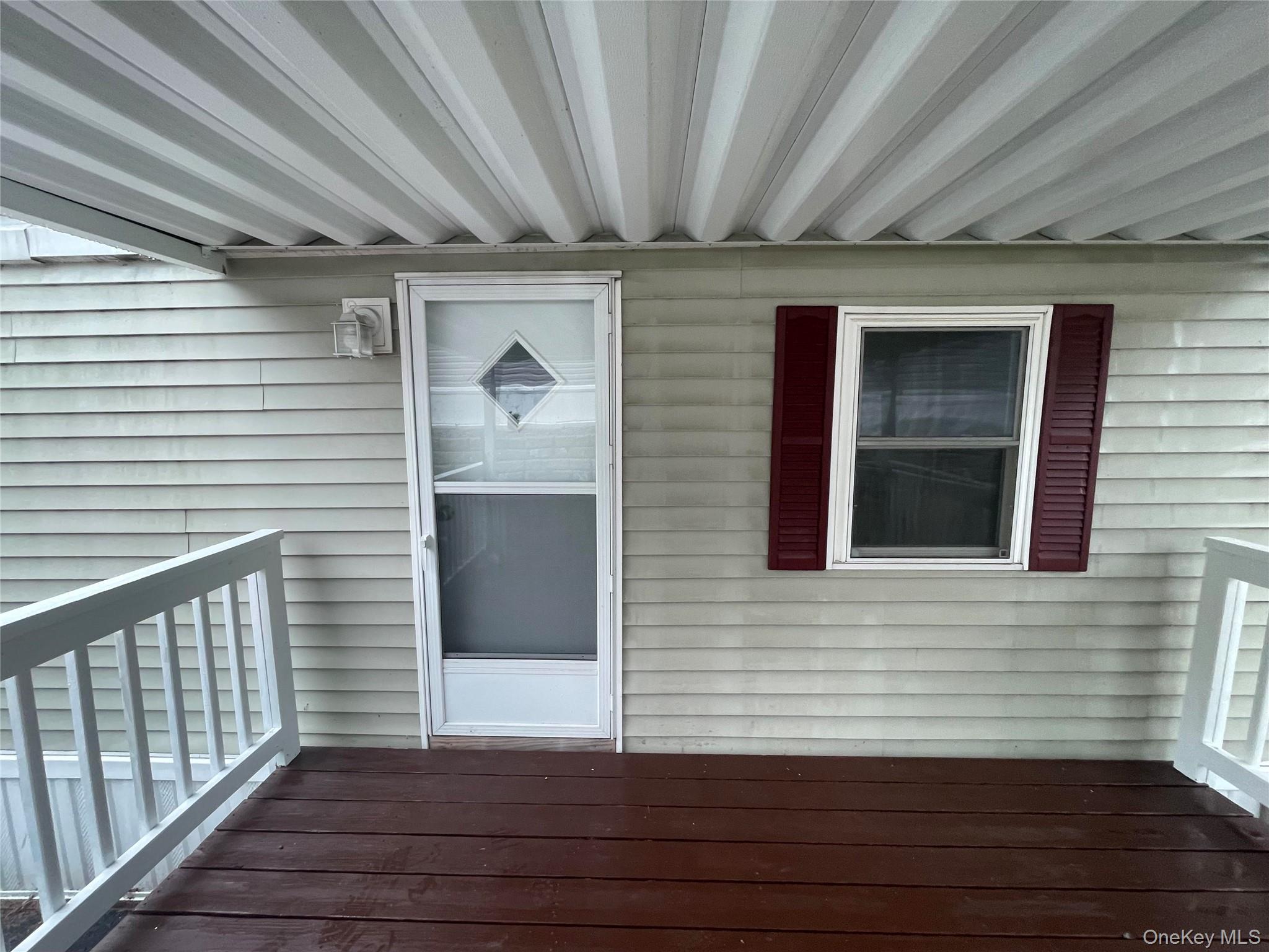 95 New Hackensack Road, Unit 45 Wappingers Falls, NY 12590 - Photo 3 of 17 Porch With Awning and Storm Door
