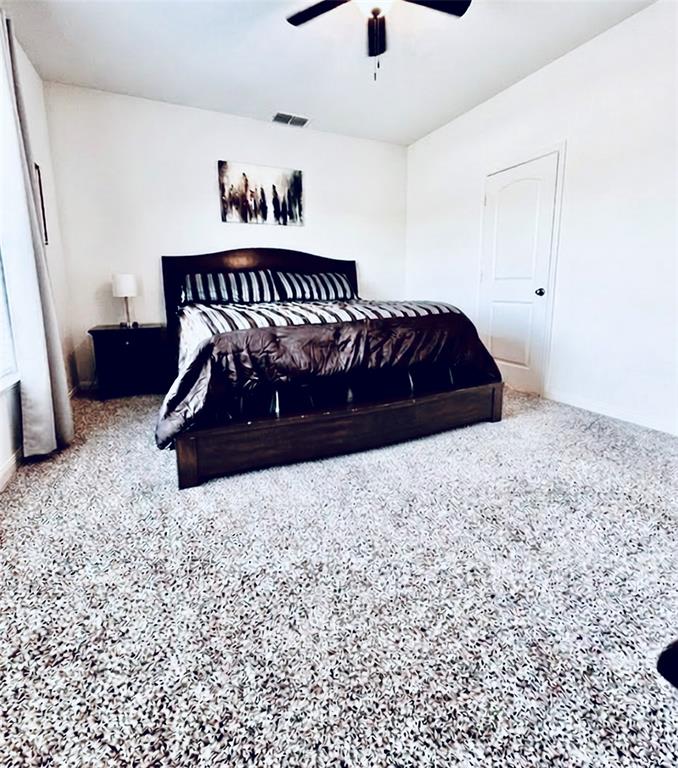 196 Cattlemans Crk Road West Newark, TX 76071 - Photo 12 of 31 Spacious room featuring neutral carpet flooring, white walls, and a ceiling fan with integrated lighting