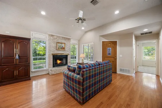 a living room with furniture and a fireplace