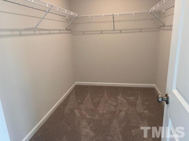 2403 Chert Lane, Unit 2403 Raleigh, NC 27610 - Photo 11 of 19 a view of a room with racks on the wall