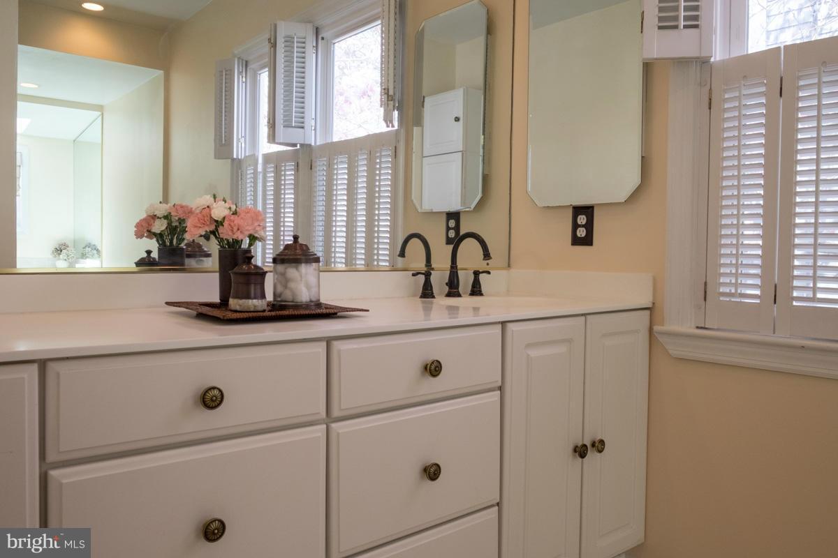119 Hawthorn Road Baltimore, MD 21210 - Photo 16 of 30 a bathroom with a sink and a mirror