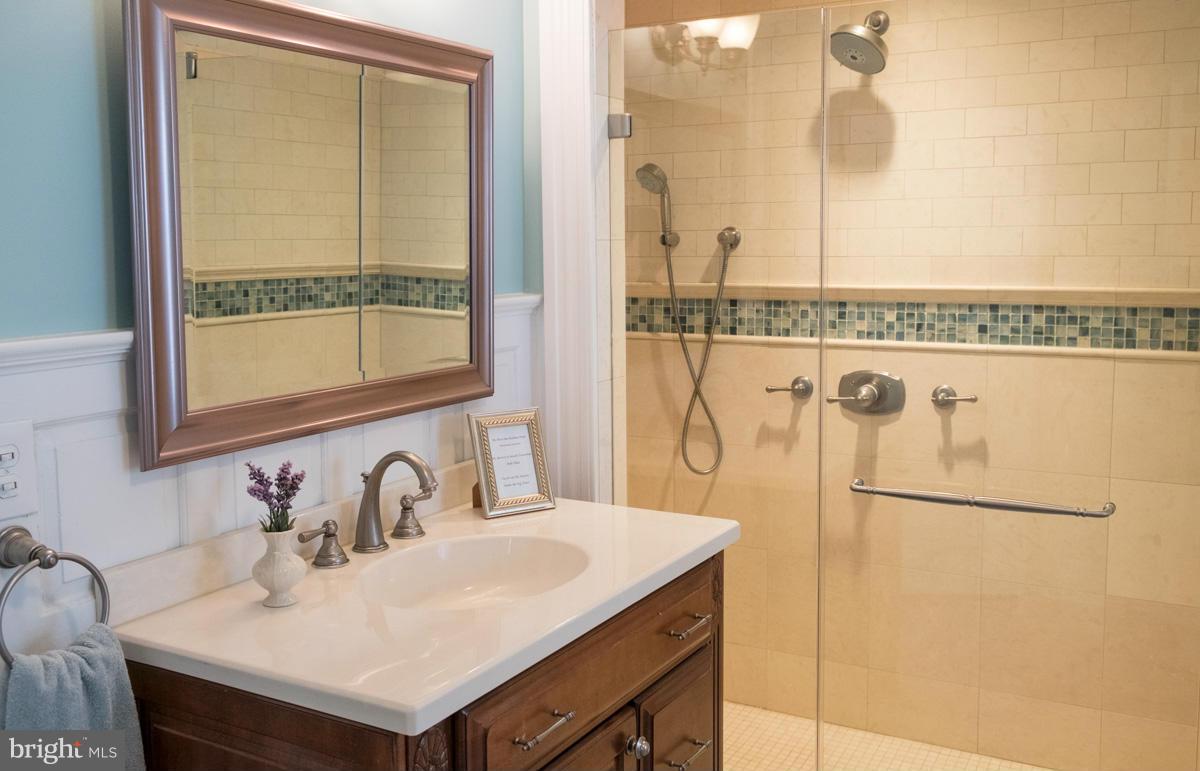 119 Hawthorn Road Baltimore, MD 21210 - Photo 21 of 30 a bathroom with a sink and a mirror