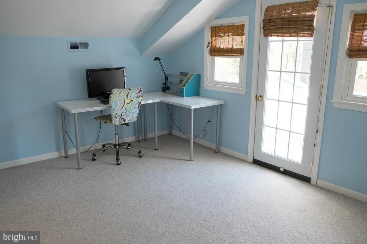 119 Hawthorn Road Baltimore, MD 21210 - Photo 25 of 30 a view of a workspace with furniture and a window