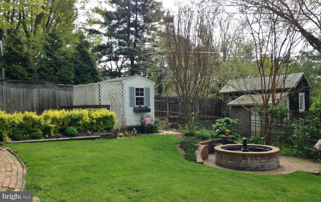 119 Hawthorn Road Baltimore, MD 21210 - Photo 27 of 30 a view of a backyard with potted plants and large trees