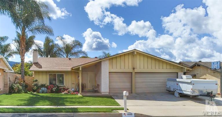 1888 Fitzgerald Road Simi Valley, CA 93065 - Photo 1 of 28 a view of a white house with potted plants and a yard