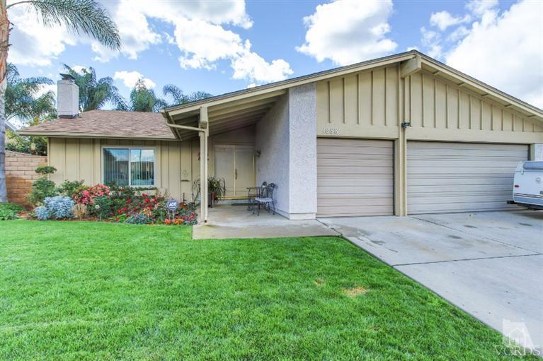 1888 Fitzgerald Road Simi Valley, CA 93065 - Photo 2 of 28 a front view of a house with a yard and garage