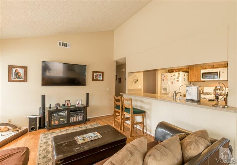 1888 Fitzgerald Road Simi Valley, CA 93065 - Photo 11 of 28 a living room with furniture and a flat screen tv