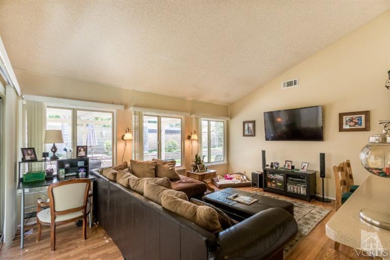 1888 Fitzgerald Road Simi Valley, CA 93065 - Photo 12 of 28 a living room with furniture and a flat screen tv