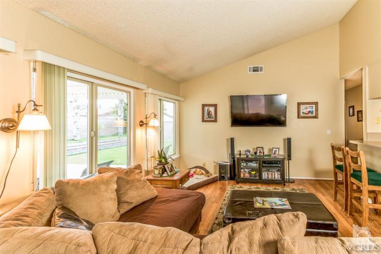 1888 Fitzgerald Road Simi Valley, CA 93065 - Photo 14 of 28 a living room with furniture and a flat screen tv